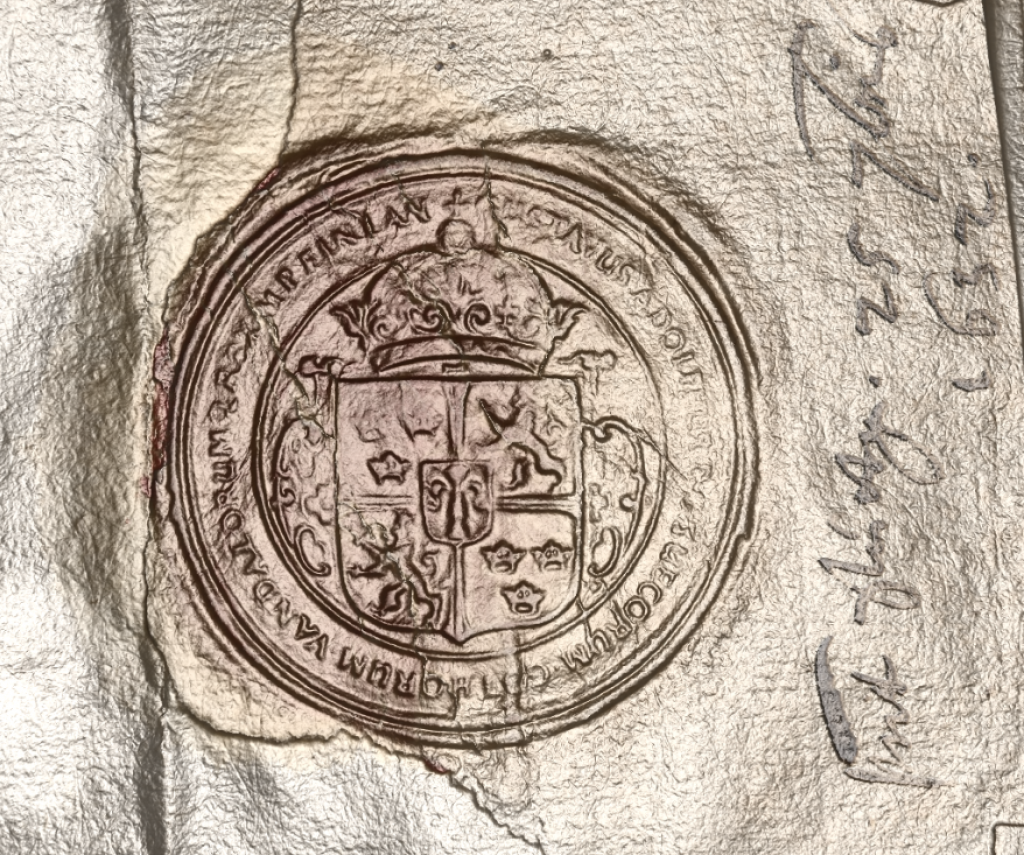 This version of the seal done using RTI and shown in relief, exposes further detail and renders the text more clearly.